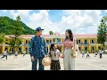 Veteran Ha An happily takes Tieu Dau to school with the young teacher