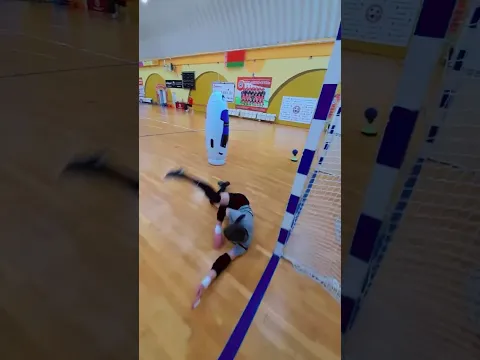 Fast-paced Goalkeeper Training Session in Indoor Sports Facility