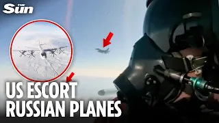 Moment Russian pilots film US fighter jets escorting them over Alaskan air space