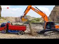 Lagu Video kapal keruk raksasa doosan menggali batu dan dimuat ke truk dam pasir sampai penuh