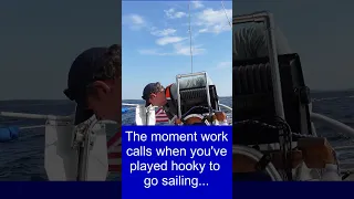 The moment work calls when you’ve played hooky to go sailing…