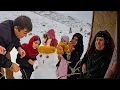 Building a beautiful snowman among the snowy mountains