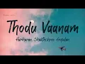 Download Lagu Thodu Vaanam Lyrics -  Anegan | Harish Jayaraj | Hariharan | Shakthishree Gopalan
