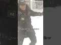 Meteorologist John Elliott makes snow angels during blizzard