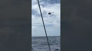 We got buzzed by a helicopter in the middle of our Pacific crossing! #family #sailing #viral