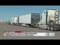 Long lines of semis outside Walmart Distribution Center in Los Lunas