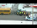Person trapped inside work van after crash with school bus