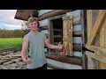 Off-grid tiny cabin build installing custom shutters update