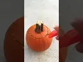 Carving a mini pumpkin