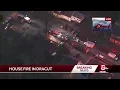 Crews battle house fire in Dracut
