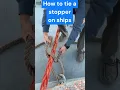 Lagu How to tie a stopper on ships to hold a mooring line temporarily.
