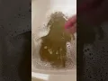 Restoring an old beat up Cabbage Patch Kid The dirty water after soak number 1