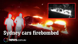 CCTV captures moment hooded figures firebomb two cars in Sydney