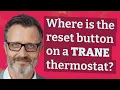 Where is the reset button on a Trane thermostat