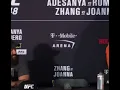 Lagu Yoel Romero reacts to being asked how his leg feels after Israel Adesanya’s kicks