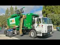 Two Waste Management of Irvine Amrep Garbage Trucks Collecting in University Hills