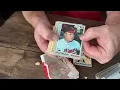 Opening a 1970 Topps baseball card pack on camera