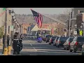 Officers public line streets of Waltham during procession for Officer Paul Tracey