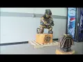 Carved from wood a healing statue for the Clinton Community and it s creator