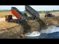 Incredible Skills Bulldozers to push the soil into the lake with trucks worked together to dump soil