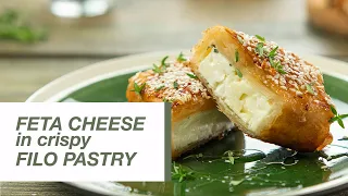 Spinach and Feta Filo Triangles are a light and delicate pastry snack that everyone will love. Spina. 