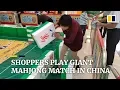 Download Lagu Shoppers play giant mahjong match in China MP3