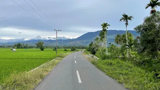 driving through beautiful rice fields in aceh indonesia