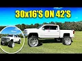 He mounted 30x16 s 42 inch tires Huge lifted Silverado on Cognito