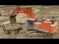 Hitachi EX1200 Loading Cat 777 trucks