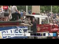 Frank climbs a firetruck to talk to Tom Stillman