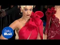 Rita Ora looks radient in red as she arrives at the Met Gala - Daily Mail