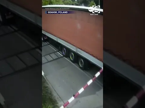 CCTV Captures Moment Train Obliterates Trailer as Truck Gets Trapped on Tracks