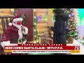 Santa arrives with personal protective equipment at Cabela s