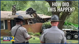 SUV lands on top of Georgia home after driver loses control
