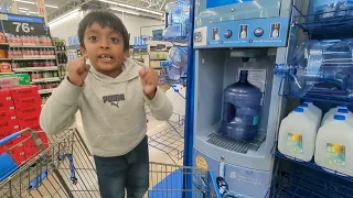 Akshay refilling primo water in Walmart it s kind of fun for him