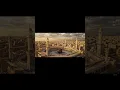 Download Lagu Cinematic Aerial View of Makkah at Its Historic Peak – Majestic Architecture and Pilgrims in Golden