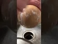 Cleaning a Cabbage Patch Kid s face with Dawn dish soap and Arm Hammer baking soda