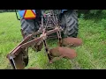 3 Bottom Plow on a New Holland Plowing Sod Hay