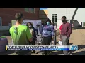 Coach Prime and OOFUS donate shoes to teachers staff at Blackburn Middle School