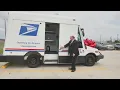 U S Postal Service unveils new delivery vehicles and upgraded facility