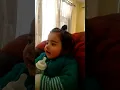 Baby playing with empty bottle...