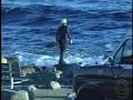 Archival Footage Investigators gather wreckage from John Denver s plane crash 1997
