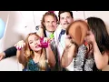Two cute couples having fun in party photo booth Stock Footage - Envato elements