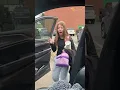 Girl surprised with puppy as it poops in car