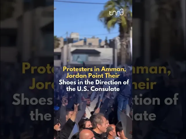 ⁣Protestors in Jordan raise a shoe in direction of the US embassy. “America is the head of the snake”