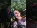 Two Mermaids Washed Up on the Beach Tangled in a Fishing Net