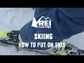 How to Put on Skis REI
