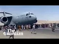 Download Lagu Afghans climb on to plane during takeoff in attempt to flee Taliban