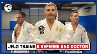 jflo teaches judo to referee jason herzog and dr aaron schneir