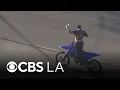LAPD pursuit ends as officers take dirt bike riding suspect allegedly armed into custody
